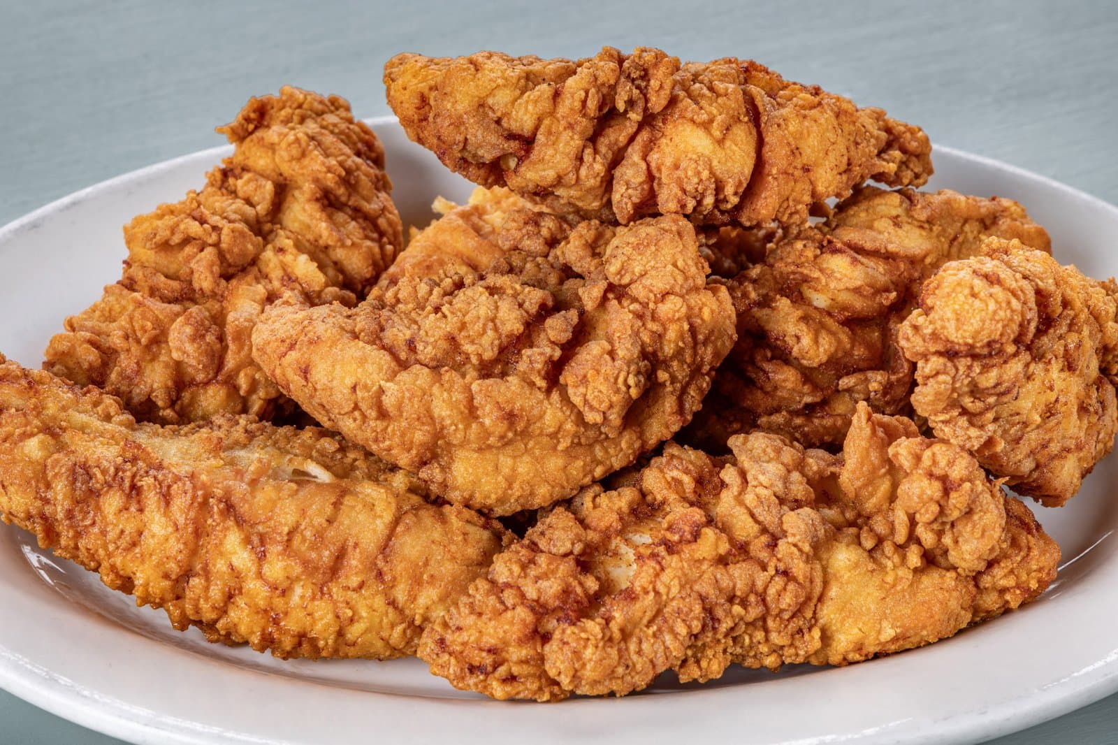 Plate of golden fried chicken tenders