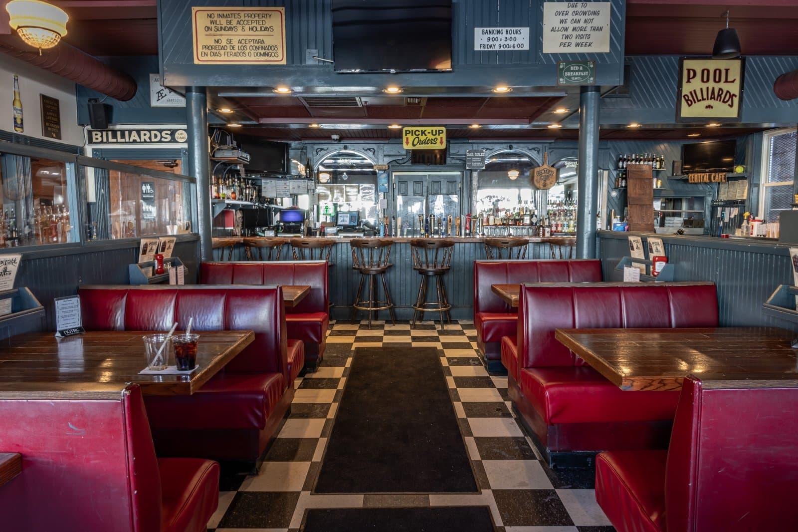 Wide view of the dining room, bar, and vintage signs
