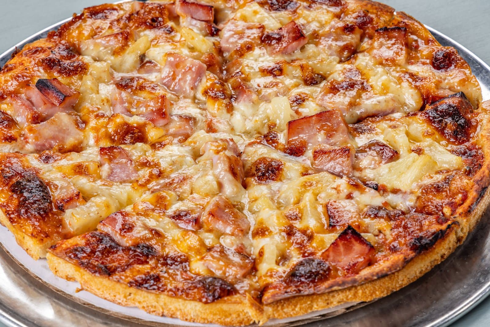 Hawaiian pizza with ham and pineapple